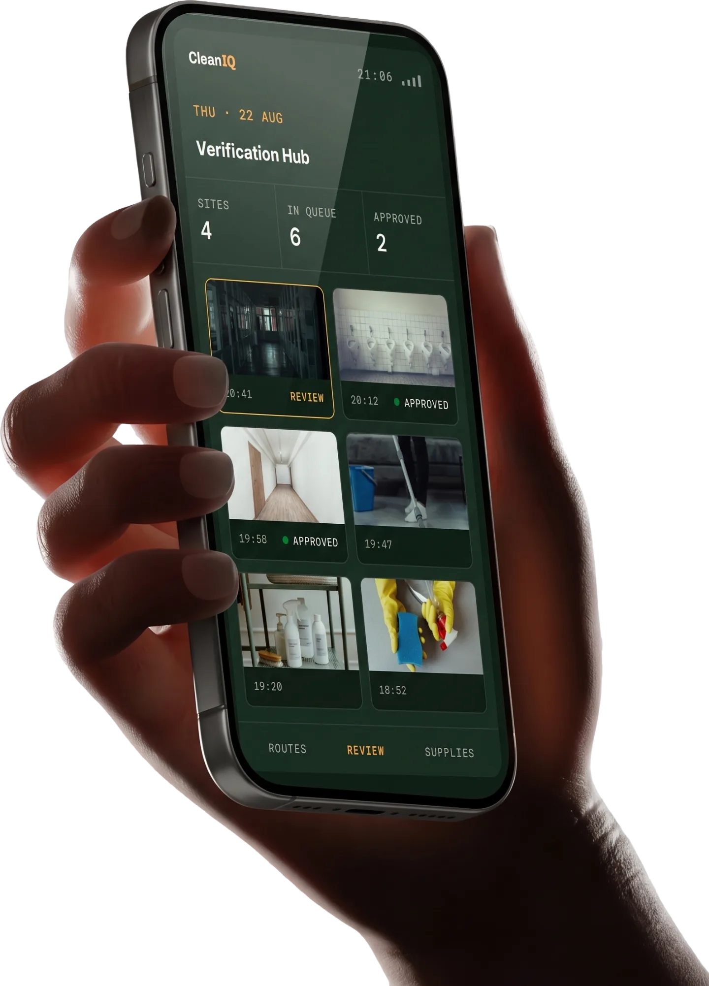 A hand holding a phone showing the CleanIQ manager review hub: six stamped photos from the night's sites, two approved. Interface preview, sample data.